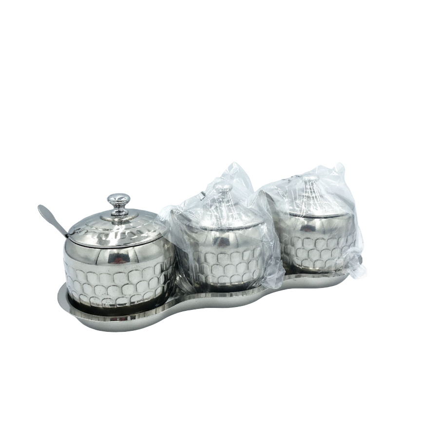 Silver three-jar condiment set with honeycomb design on a white background
