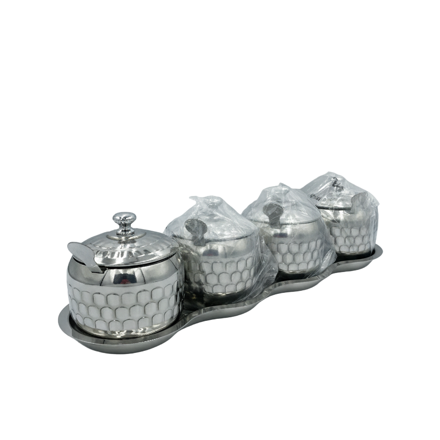 Set of four silver honeycomb-patterned containers on a matching tray against a white background